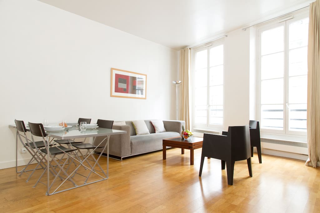 The luminous living room looking out onto Rue de la Harpe