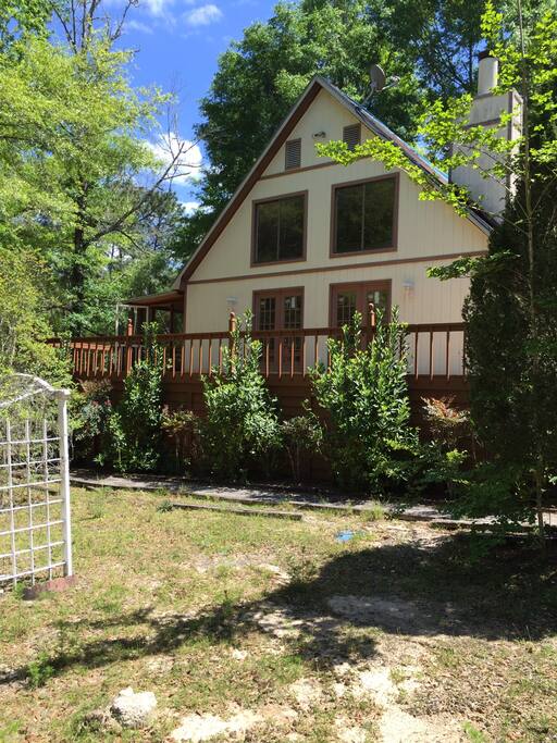 Out in the woods. There are no visible neighbors from the front porch. Lots of peace and quiet and NO traffic.