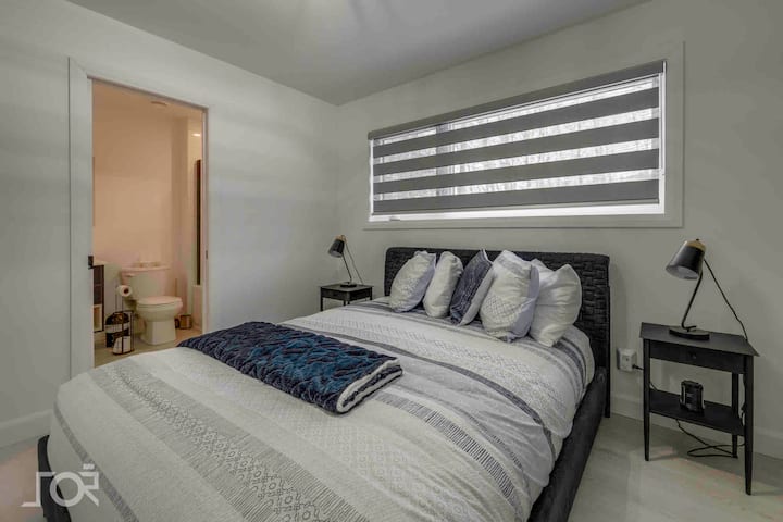 Bedroom 1 with queen bed and en-suite bath.