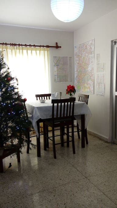 Dining Room at Christmas with half a wall of Mexico City maps