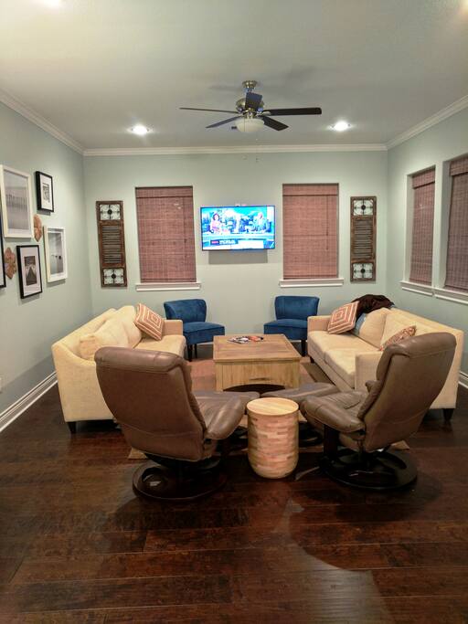 Large family room with hardwood floors.