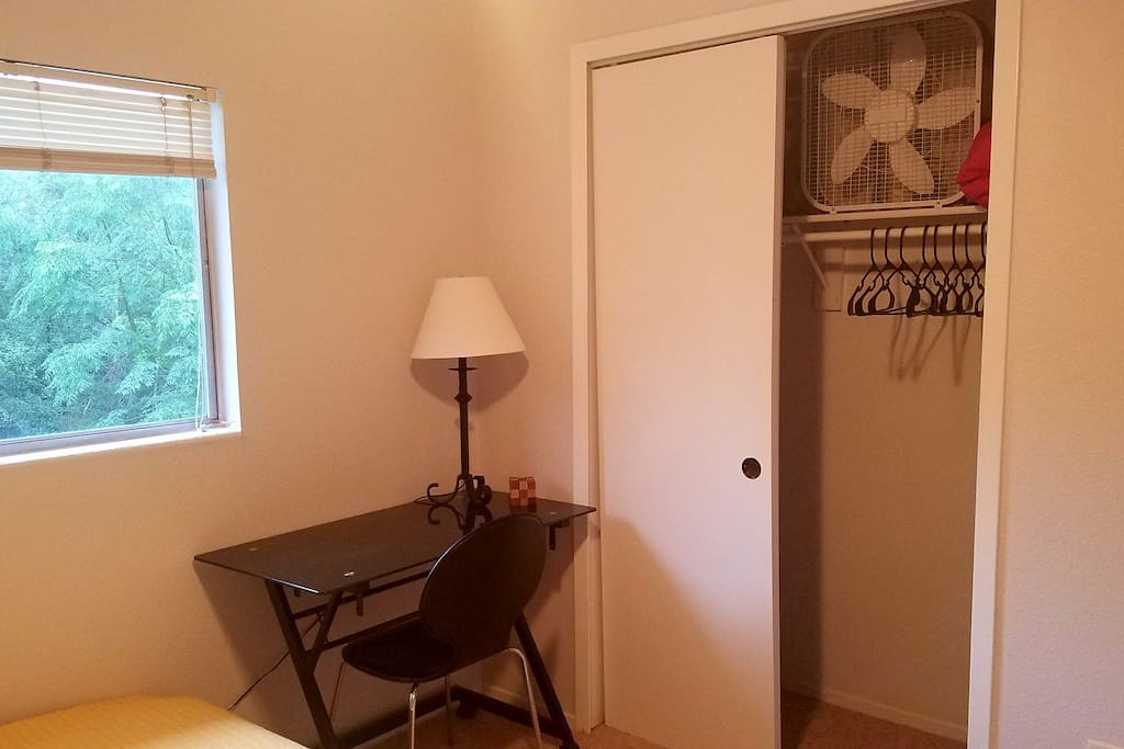 Work station. Extra fan, pillows, and hangers in closet.