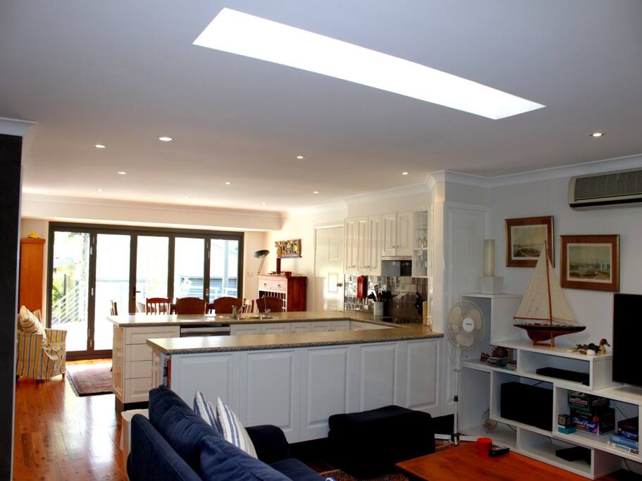 Kitchen and dining area that over looks the deck with entertaining area.