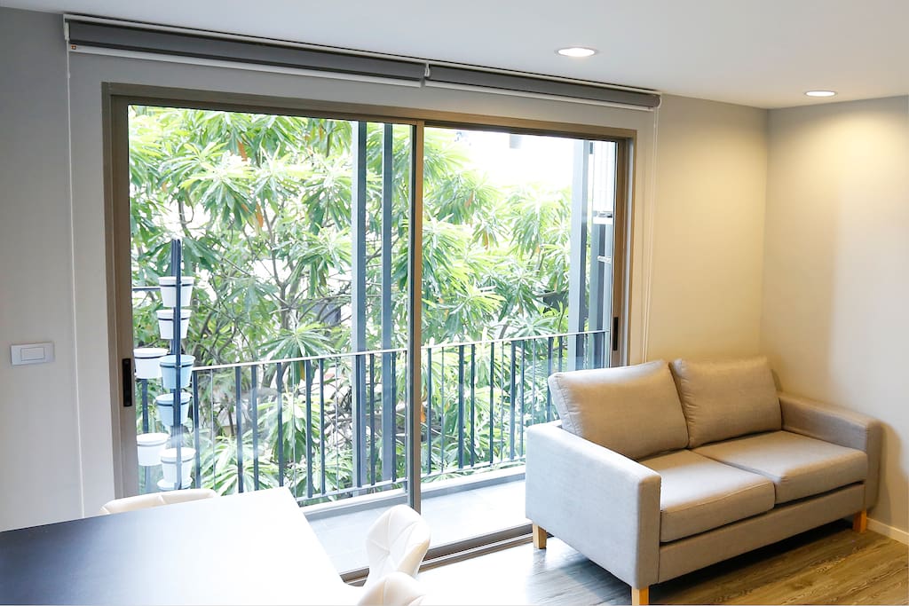 Sliding glass door at balcony with garden view