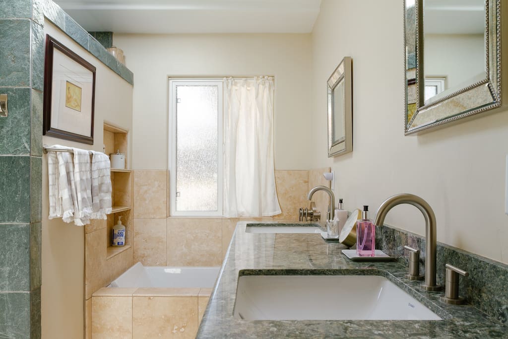 Double sinks and ample counter space amplify a pleasant and relaxed space.