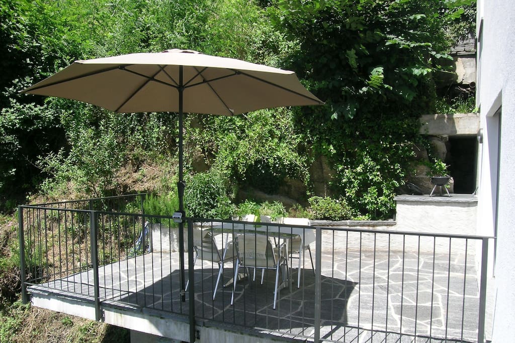 Large and bright terrace made of stone typical of the region, parasol and charcoal grill available