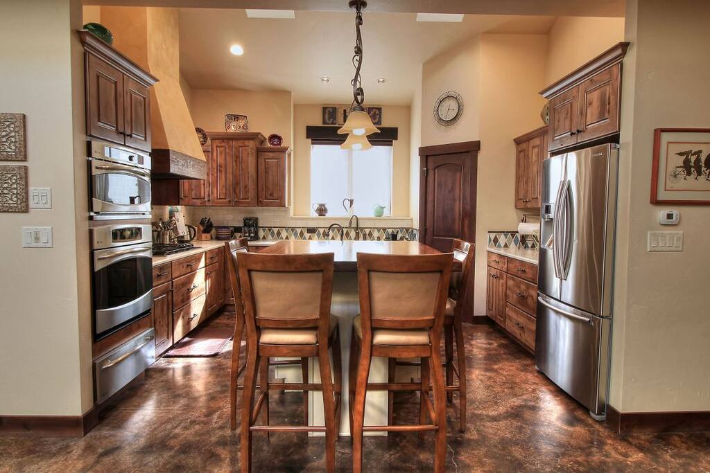 Fully equipped kitchen with large Island for prep sink and visiting.