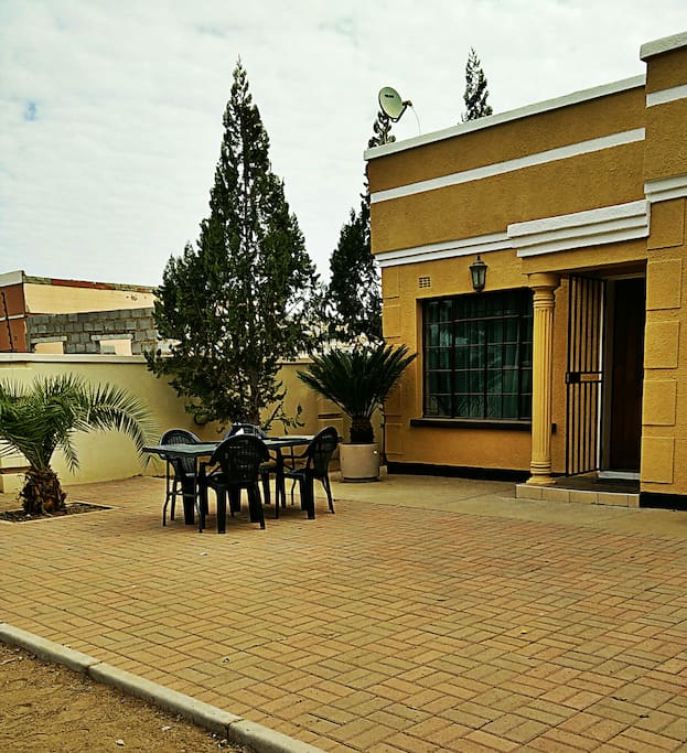 Paved area with table and chairs