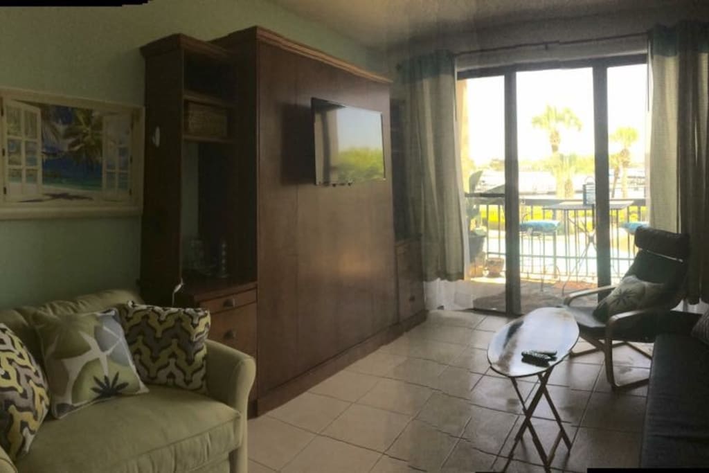small studio condo with two flat screen tv's , Murphy Bed gives you more room until you are ready to sleep there is also a sleeper small sofa, very comfortable,