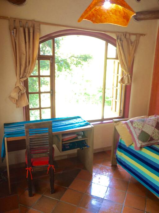 Guest room comes with a desk. There is room for setting up an extra bed.
