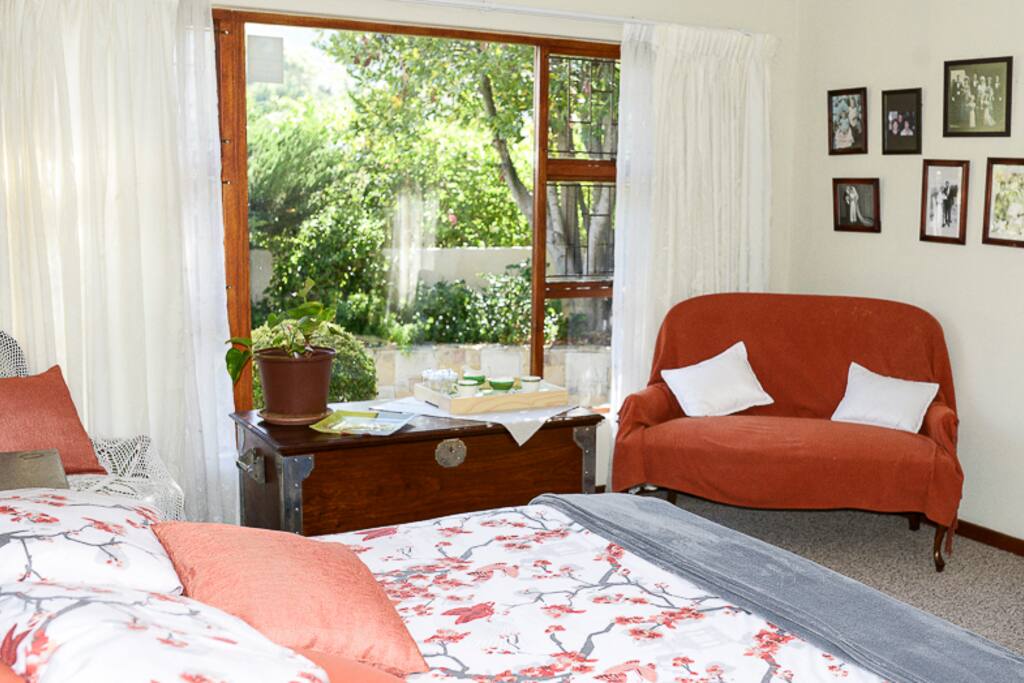 A comfortable queen size double bed,a couch , reading lamps.