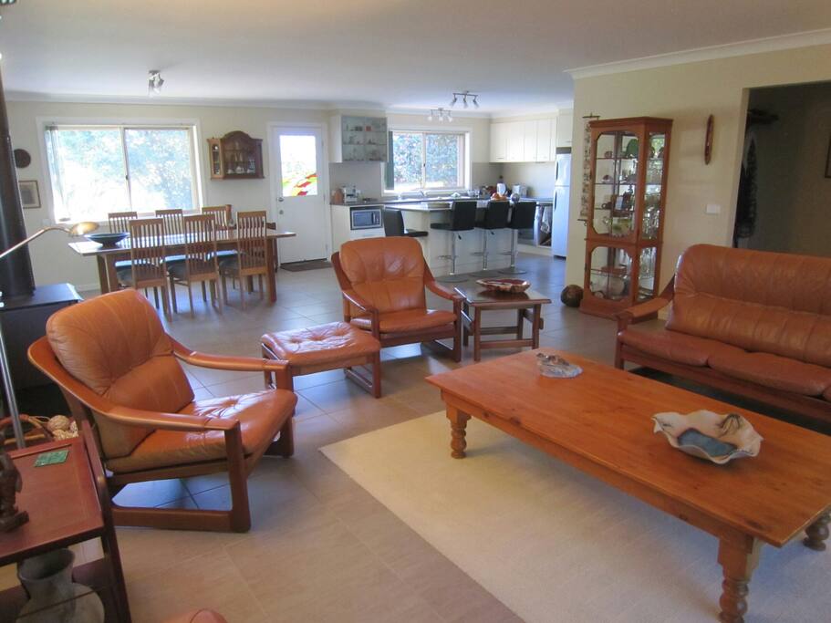 View from TV across lounge to kitchen and dining areas.