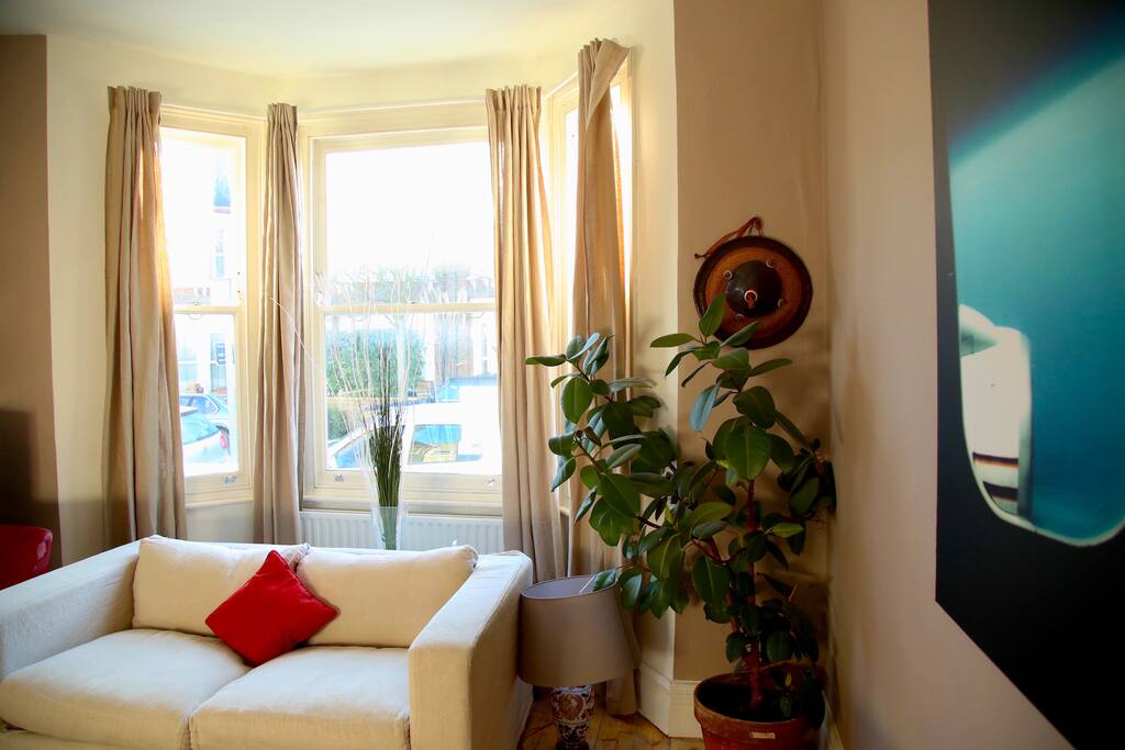 Bay windows in the living room (sofa pulls out to another double bed)