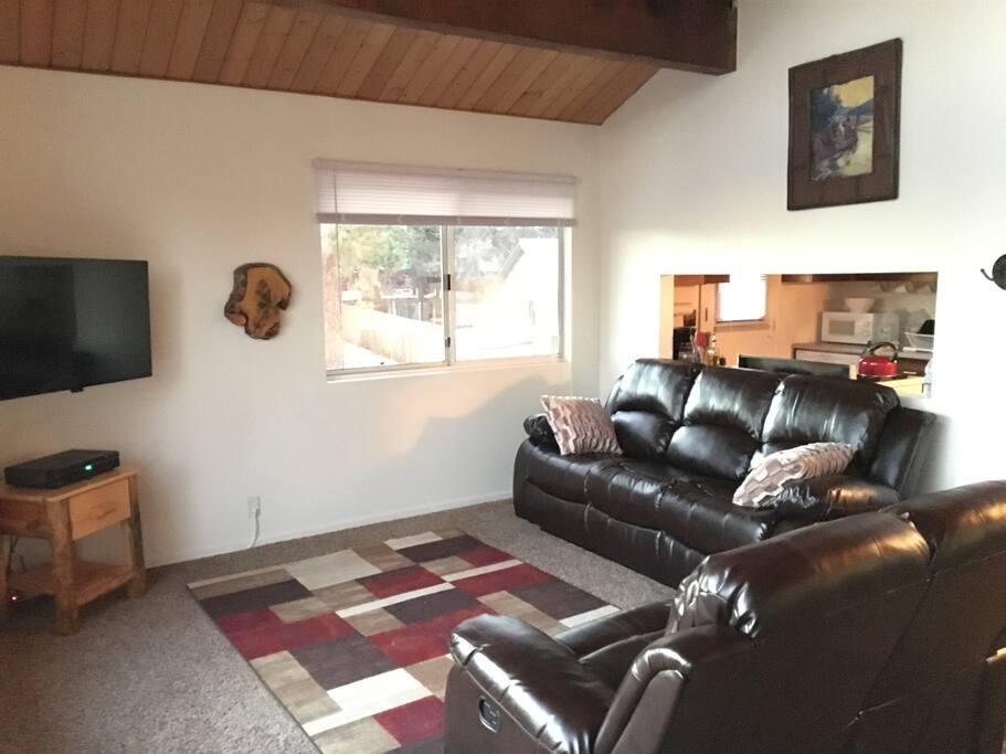 Living room complete with 4 recliners, Roku and cable TV