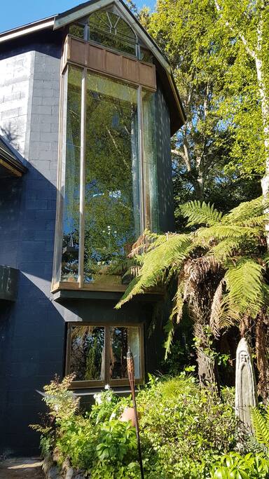 From Tower looms above the courtyard, hot tub and pizza oven.
