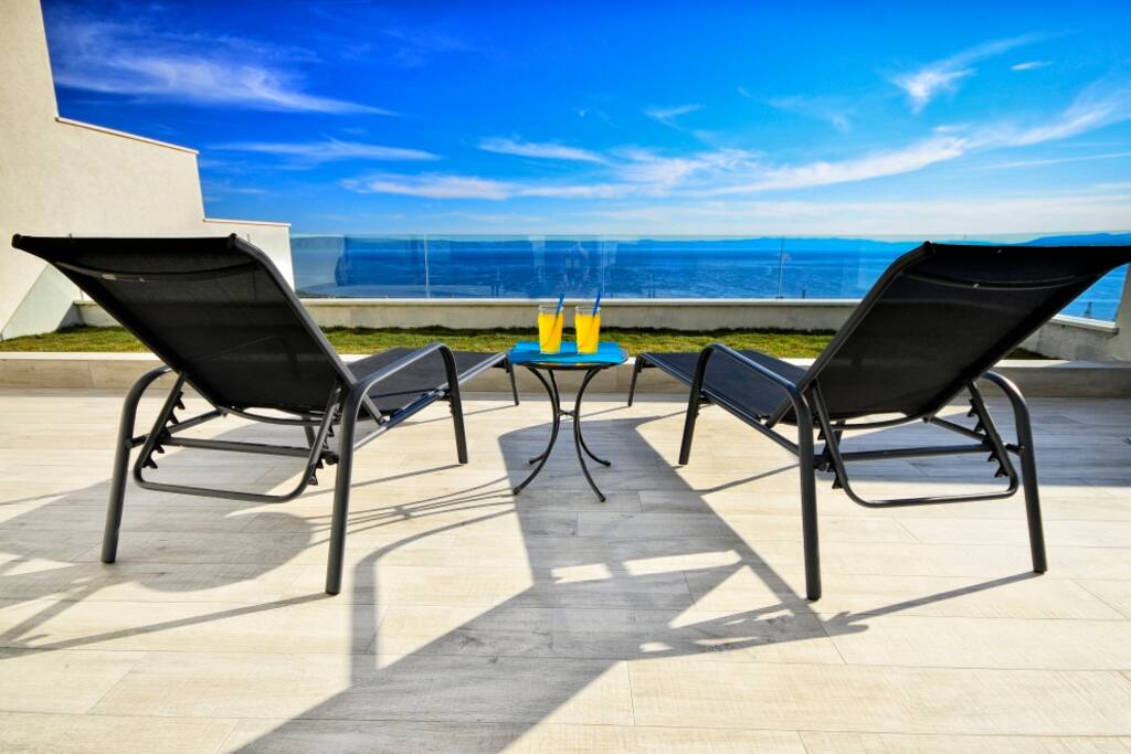 Open, sun roof terrace with sea view