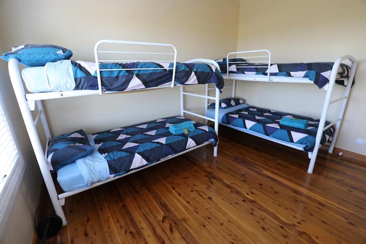 Bunkroom with four single beds (infant cot can be set up on request)