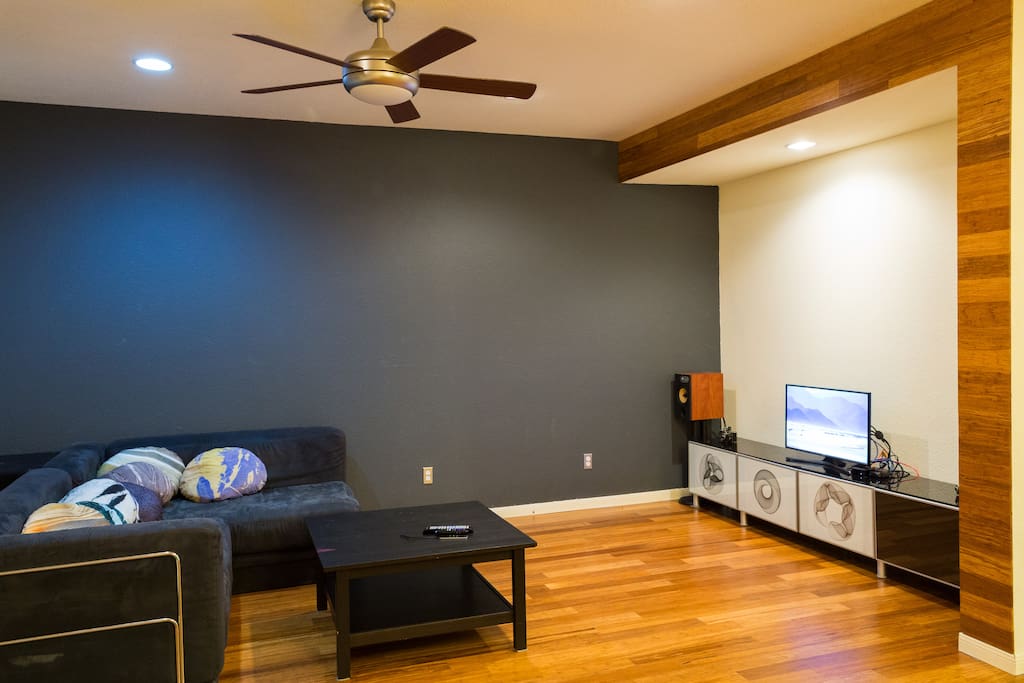 View of living room. Please note that there is now a projector connected to Apple TV instead of the physical TV.