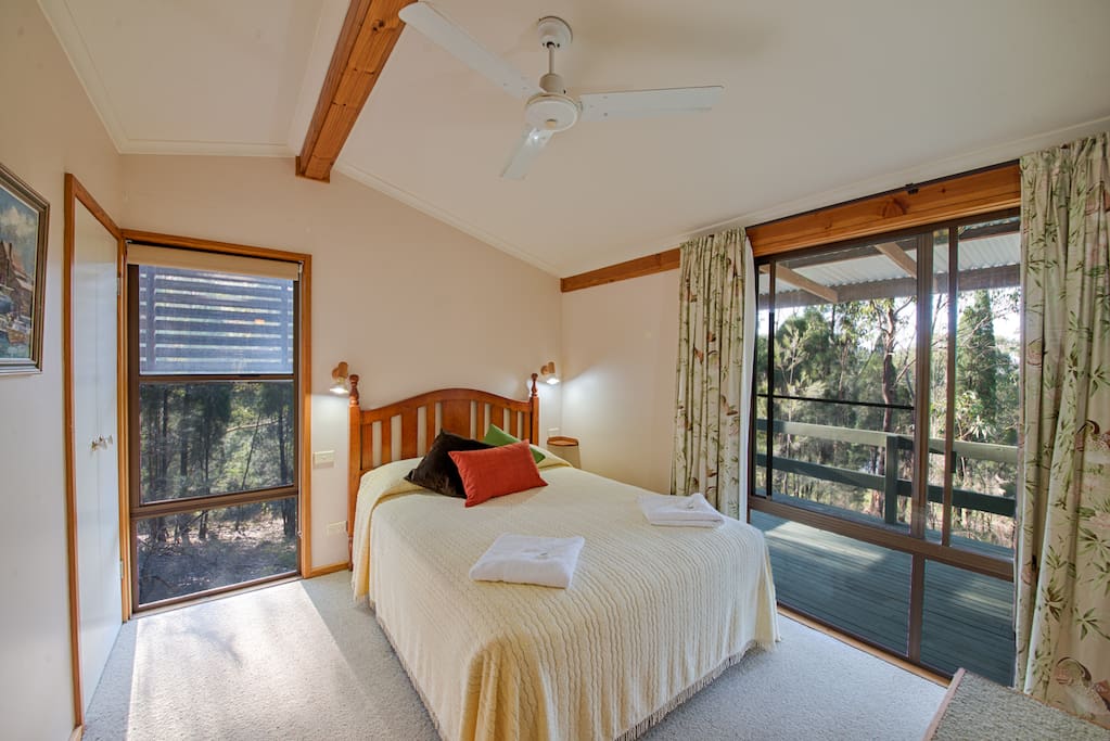 One of the three en-suite bedrooms with a queen bed.