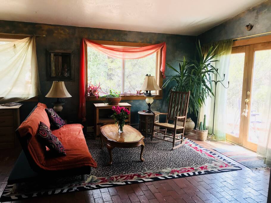 Cozy living room area with futon couch for extra sleeping.