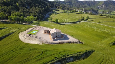 Masia in the middle of nature with a pool