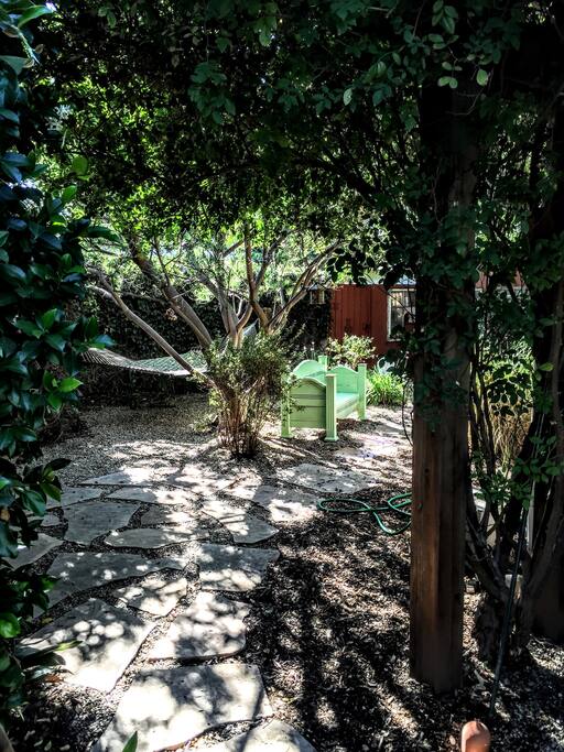Backyard has fruit and shade trees, hammock, spa, and full privacy