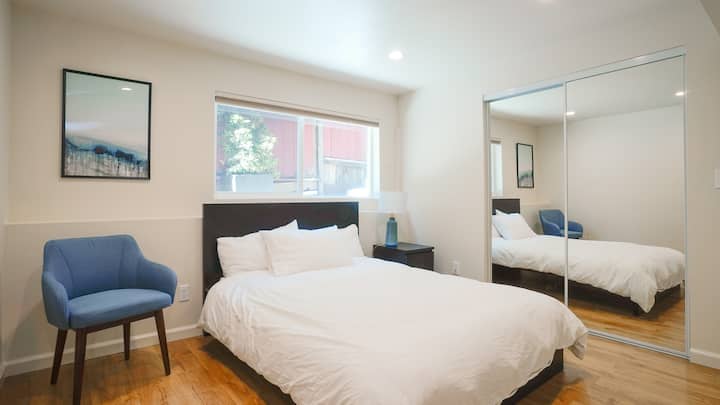 The blue room with a full size bed equipped a Tuft and Needle Mattress. Ample closet and shelf space for your things.