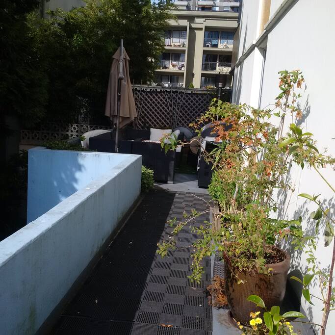 Back patio. Full couch, umbrella and BBQ