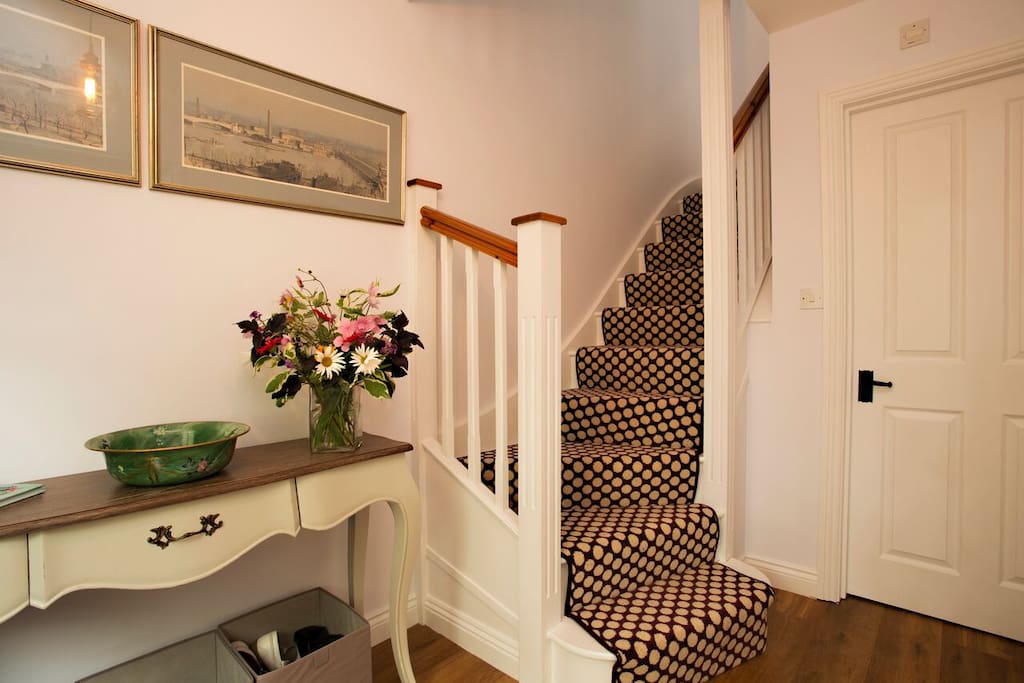 Grand entrance hallway. Fabulous designer carpet, console table, coat hooks, umbrella stand, shoe/boot boxes. Door to large cloakroom with WC & basin, feature designer map wallpaper. Full gas central heating.