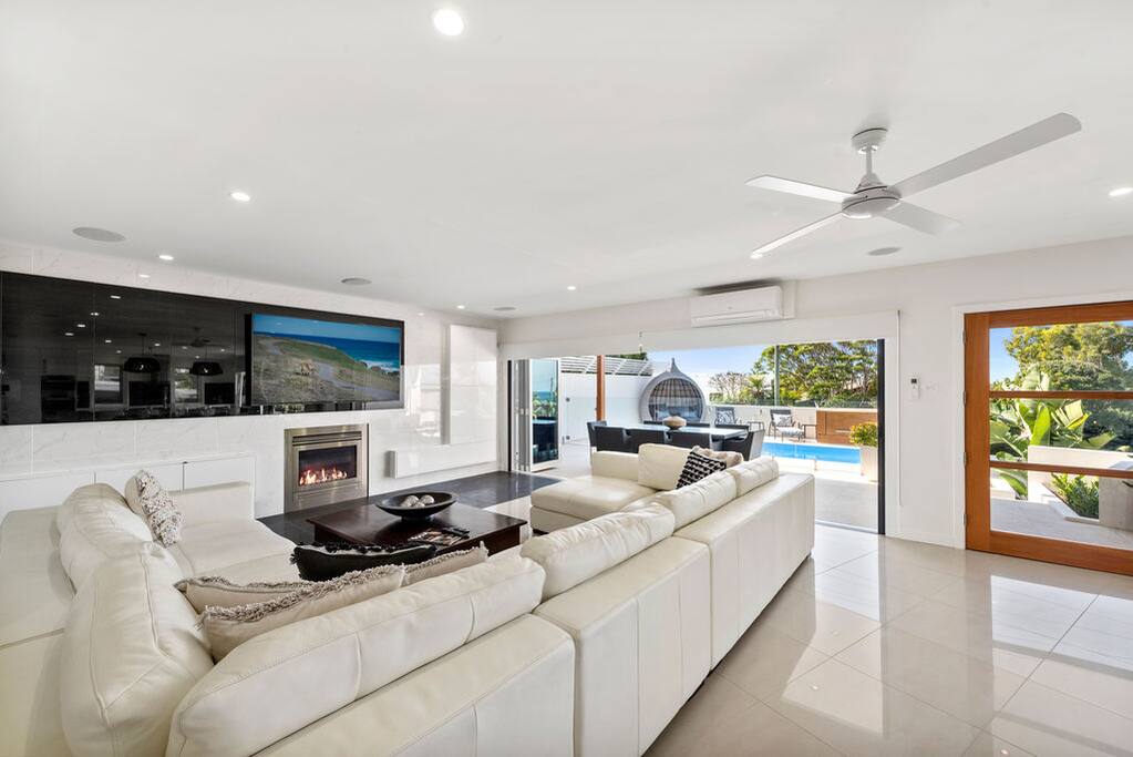 3 huge lounge areas on three levels of the home. 75 inch TV. Fire place