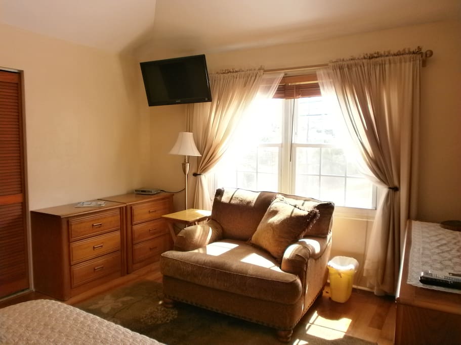 Relax in the huge chair in the bedroom!