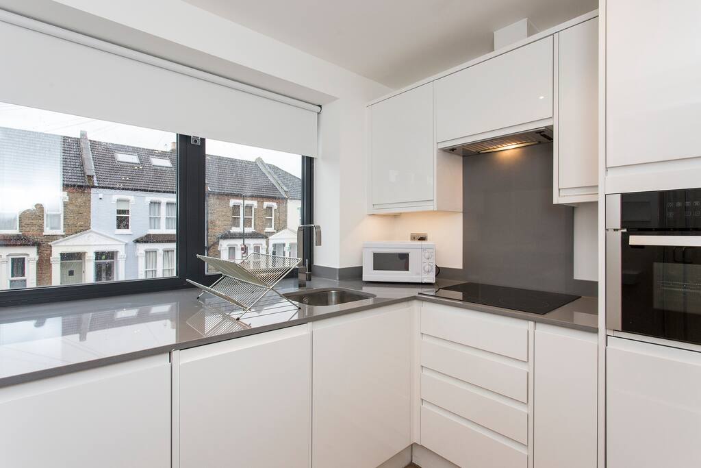 Kitchen: It has a microwave, toaster, owen, all kitchen utensils ( cutlery, can opener, wine glasses, ect )