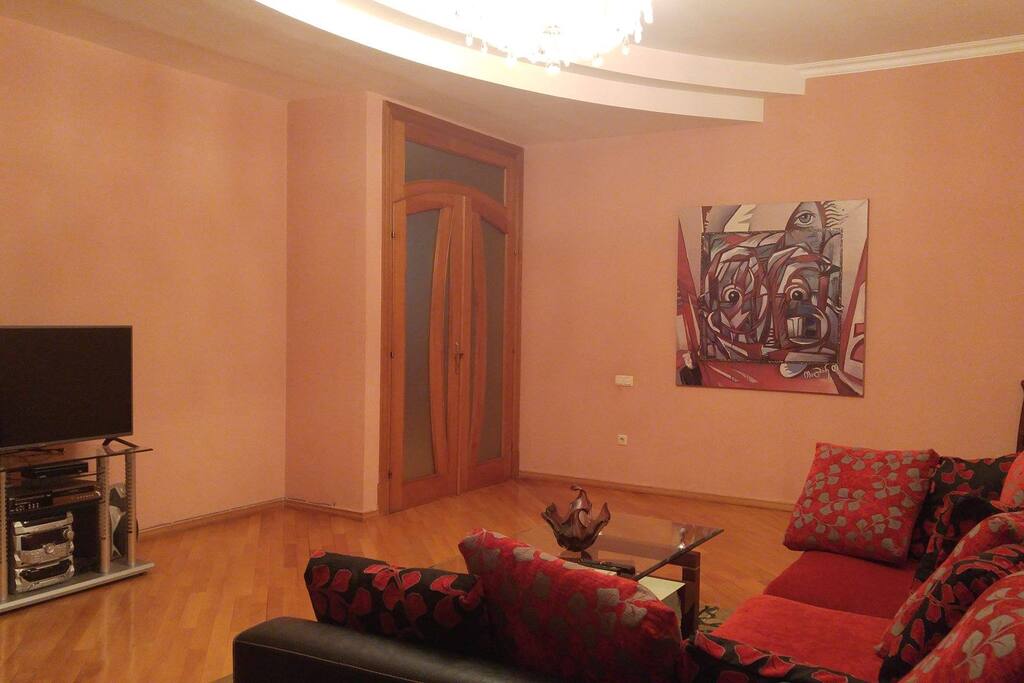 In the living room there is a TV set with more than 150 channels with the possibility to change the language to English
