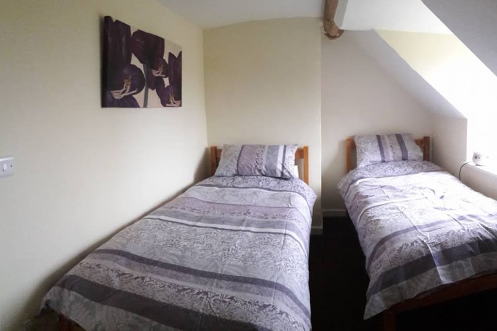 Twin room with field view, drawers & landing wardrobe.