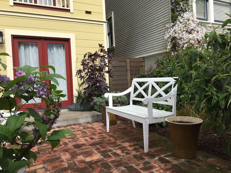 Private front patio is bursting with roses!