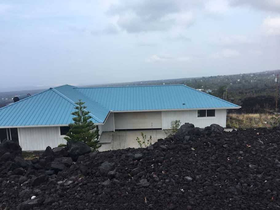This is Aloha House, your room is on the right of the garage.
