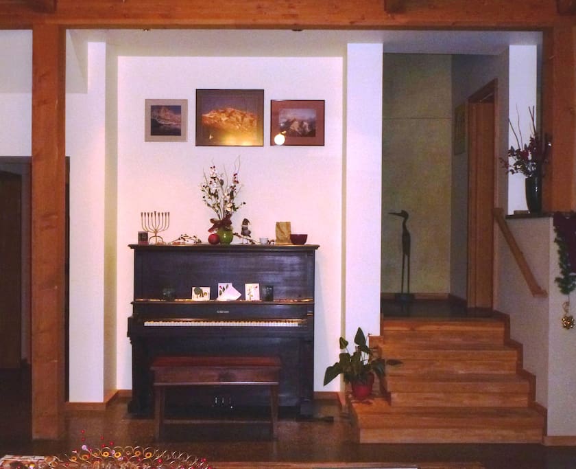 1928 piano; stairs up to private rooms.