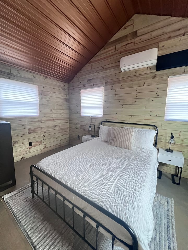Upstairs bedroom with Queen and dresser.