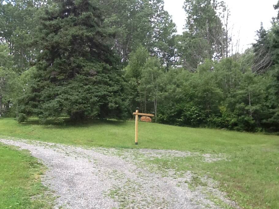 Guest parking area on the right at the bottom of the hill.