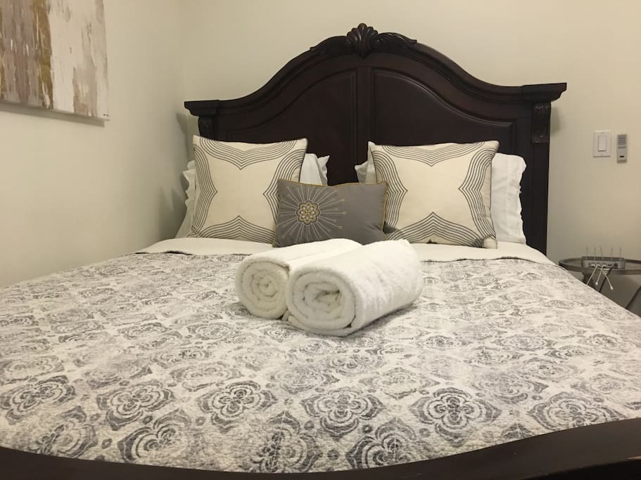 Queen bed with clean bedding and towels. We wash ALL bedding before every new guest including the comforter