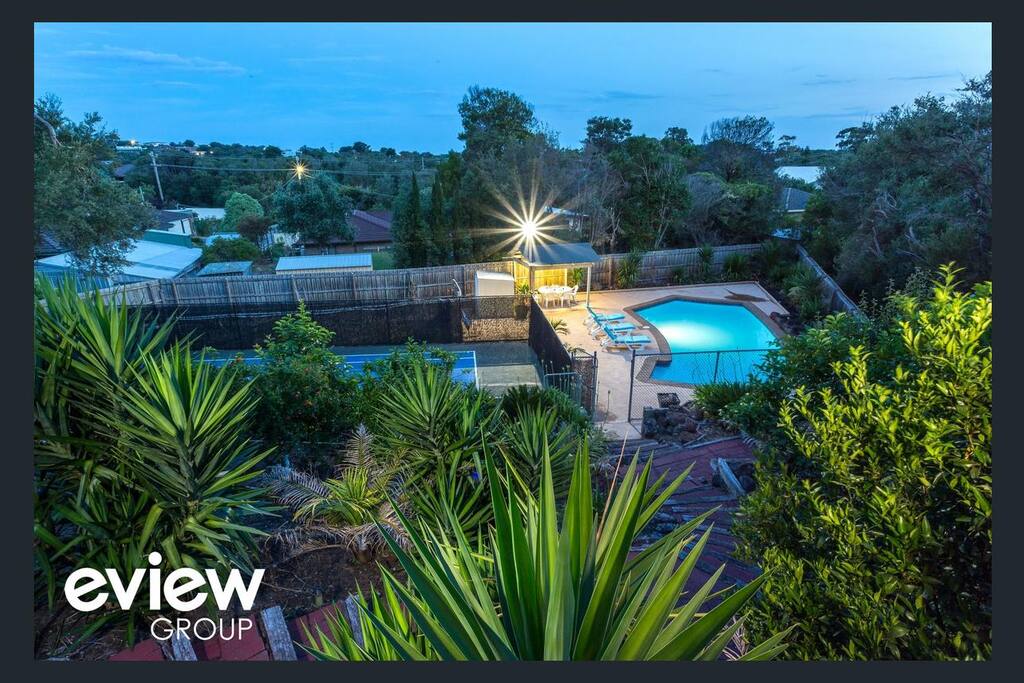 Looking down to the pool and tennis court