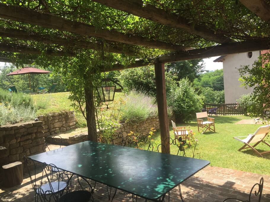 under the arbor in front of the house