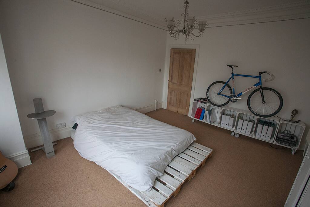 Stained-glass windows, high ceilings, double bed