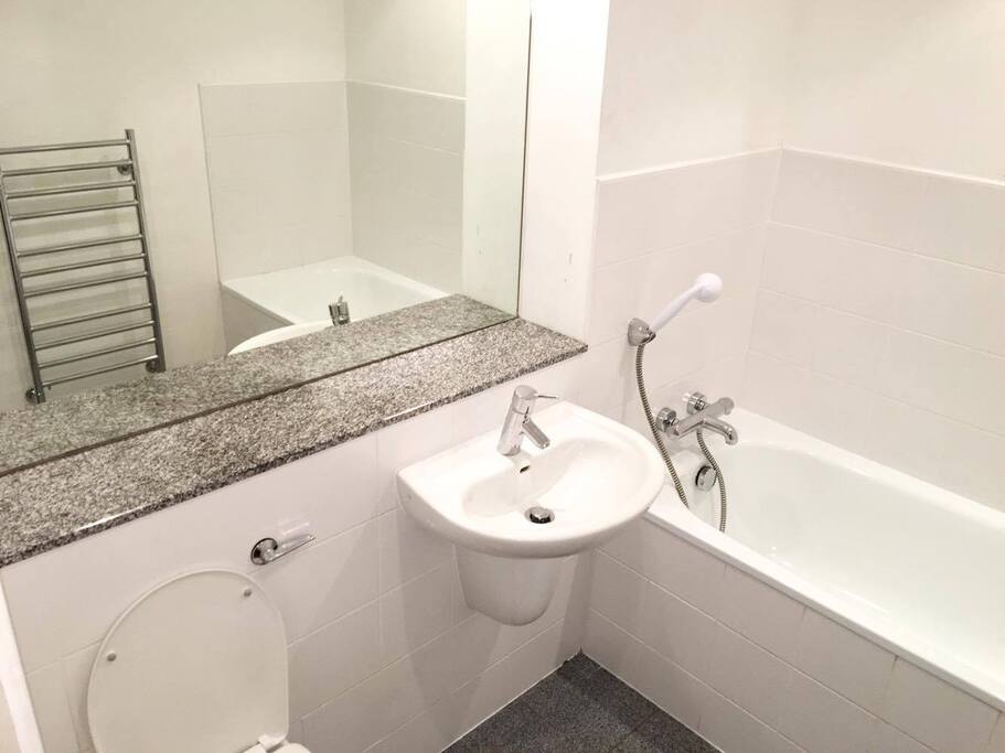 Private bathroom with shower and bath