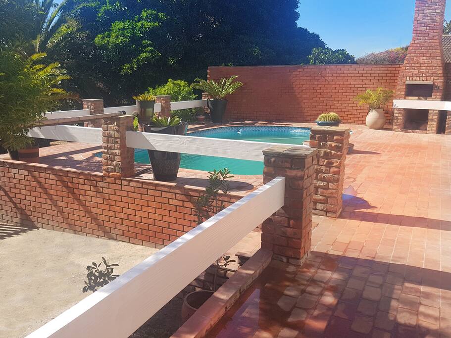 The apartment overlooks the pool and tropical garden