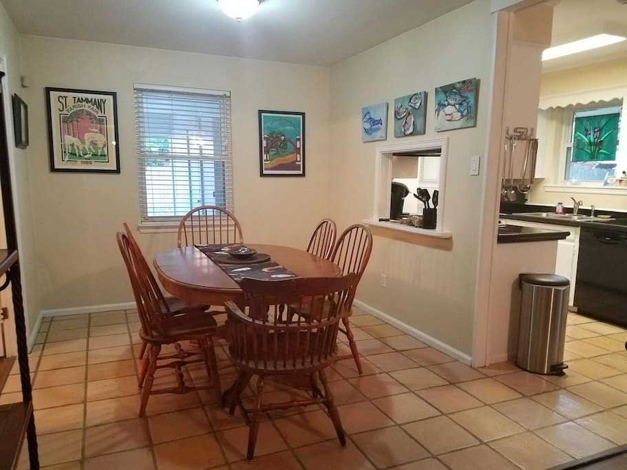 Large and spacious dining area with table with leaves, seats six or more; pass-through from kitchen which is immediately adjacent to dining area.