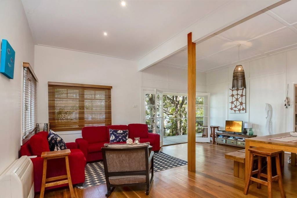 The spacious open plan living area with flat screen tv