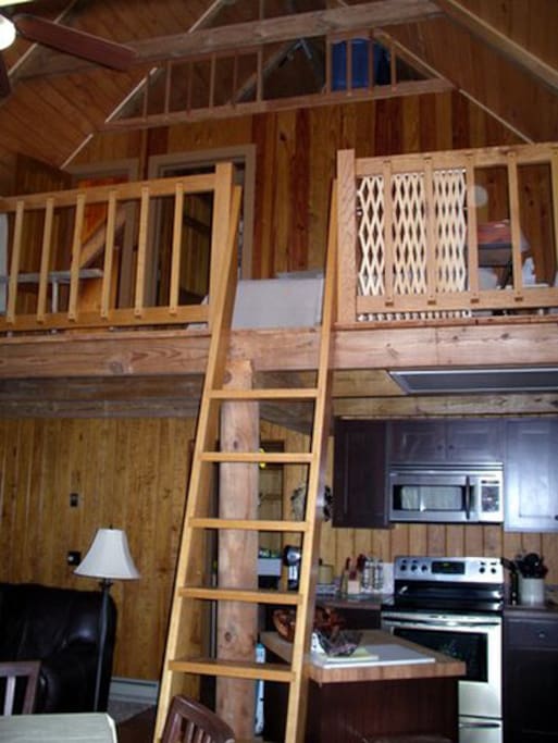 Ladder to the loft with bedroom, bathroom, and twin beds