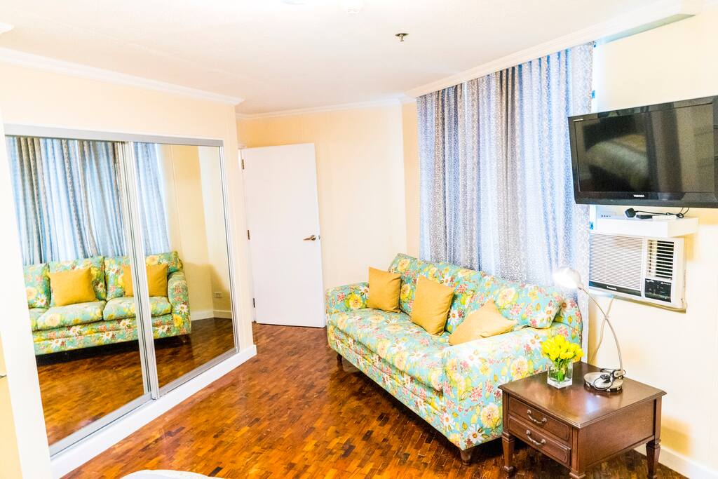 Bedroom 1 - Big closet, coach, and TV in the same room