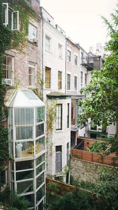 The living room and bedroom windows look out over the courtyards of the neighboring brownstones.